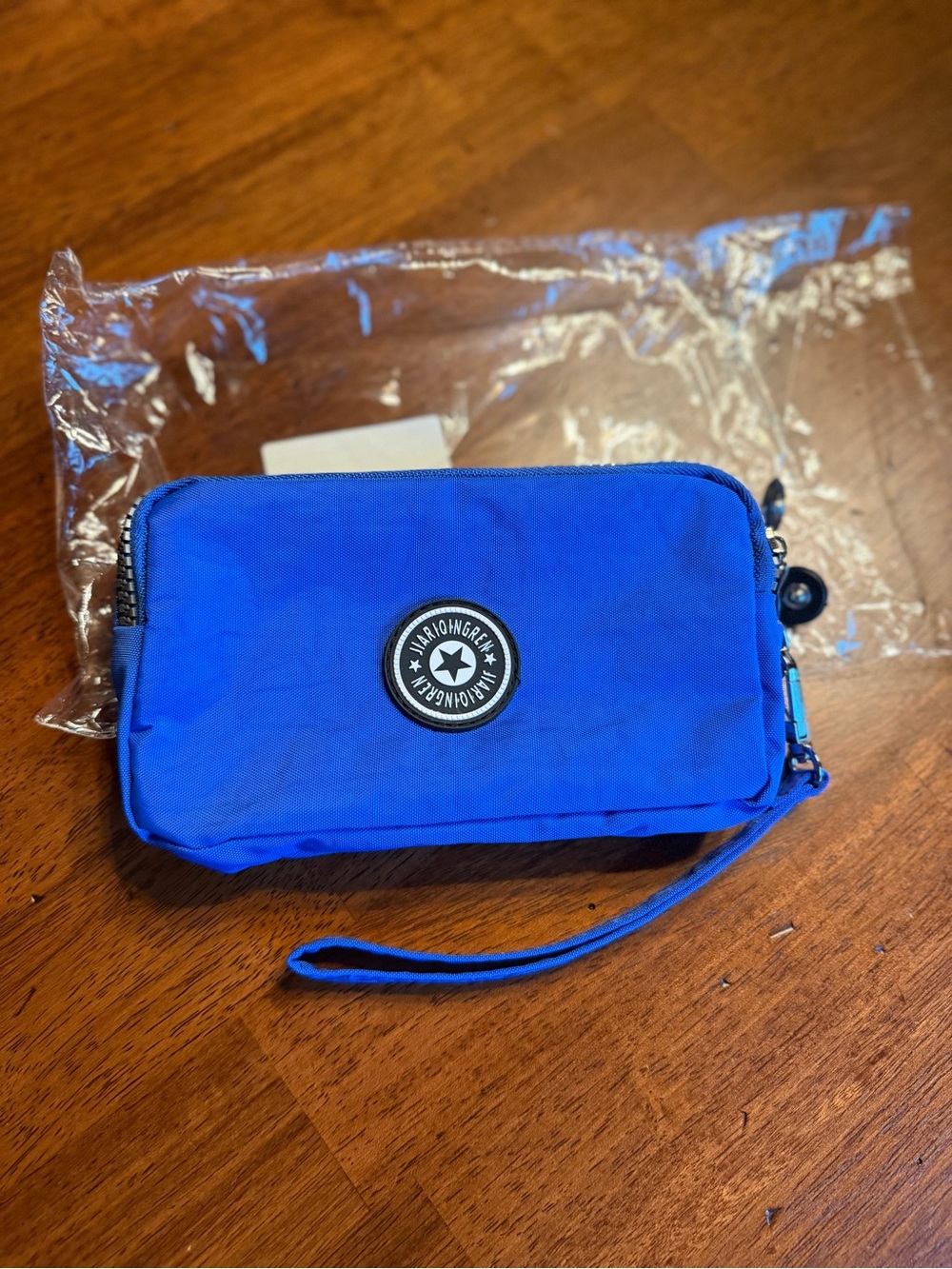 REI Blue Wristlet Pouch with Round Logo Patch- New with Packaging